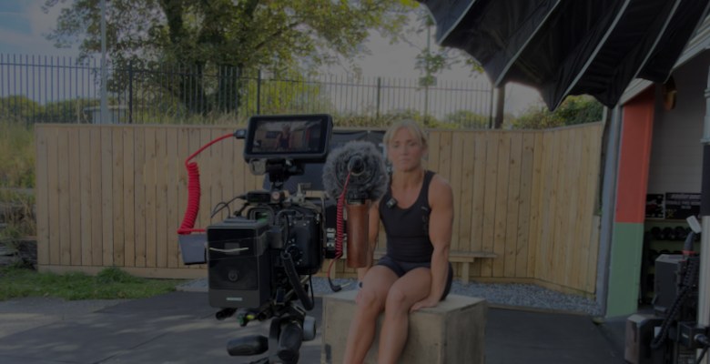 PMC filming a member interview outdoors at a gym